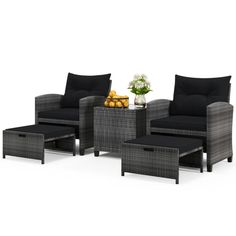 an outdoor furniture set with black cushions