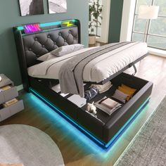 a bed with a lit up headboard and foot board on it's side