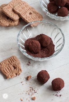 three glass bowls filled with cookies and chocolate