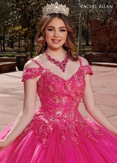 a woman in a pink dress with a tiara