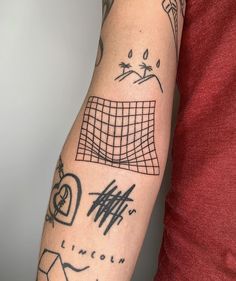 a man's arm with tattoos on it, including lines and shapes in black ink