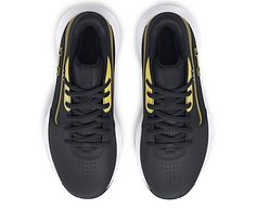 a pair of black and yellow sneakers