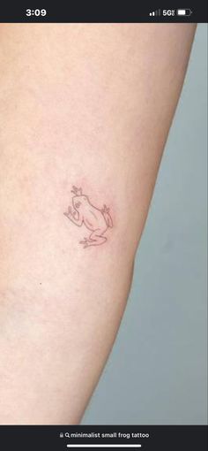 a small tattoo on the thigh of a woman's leg that has a rabbit in it