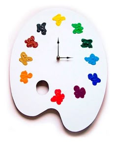 a white clock with multicolored teddy bears on it's face and hands