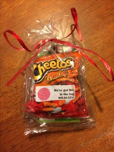 a packaged candy bag sitting on top of a wooden table