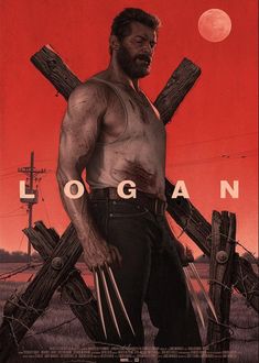 a man standing in front of crosses with the word'logan'written on it