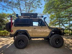 an off road vehicle is parked in the shade