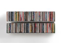 two shelves filled with various types of cds