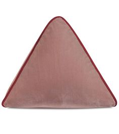 the triangle shaped pillow is pink and has red piping on it's sides