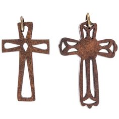 two wooden crosses hanging from hooks on a white background with the words traditionss written in gold