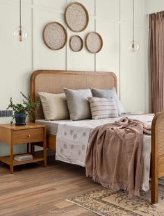 a bedroom with white walls and wooden furniture