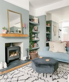 a living room filled with furniture and a fire place