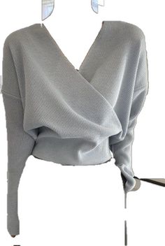 Chic Knit V-neck Blouse, Cozy Oversized Fine Knit Tops, Gray V-neck Blouse For Fall, Cozy Fine Knit V-neck Tops, Chic Knitted Tops For Layering, Chic Long Sleeve V-neck Sweater For Winter, Fall Layering Knit Tops, Chic Gray V-neck Sweater, Trendy Ribbed Winter Tops