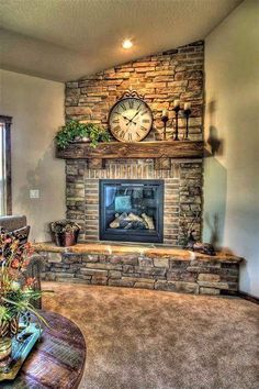 a living room filled with furniture and a clock on top of the fireplace mantel