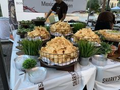 several baskets filled with food sitting on top of a table