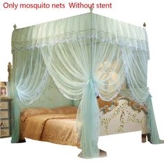 a canopy bed with sheer curtains on it and a night stand in front of it