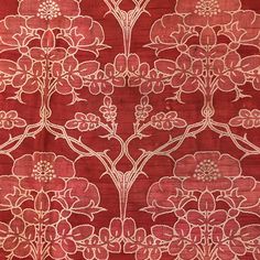 a red and white floral pattern on fabric