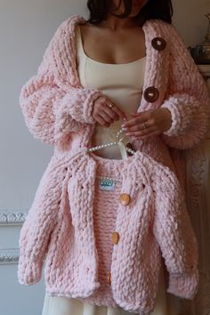 Introducing our latest one of a kind addition: The "Cozy by Mariana" hand-knit sweater for kids, in Blush Pink. Crafted with care, this oversized beauty is like wearing a warm hug. Made for easy care with machine washable fabric, it's your go-to for effortless style and comfort. Because of its oversized fit, we estimate this would fit kids sizes 5-10. Cozy Pink Soft Knit Pattern, Handmade Pink Sweater For Winter, Cozy Handmade Pink Cardigan, Cozy Handmade Knit Sweater, Handmade Cozy Knit Sweater, Cozy Pink Knitting Pattern, Cozy Knit Pattern, Cozy Handmade Pink Knitting Pattern, Handmade Cozy Pink Knitting Pattern