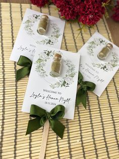 two wedding favors sitting on top of a bamboo mat