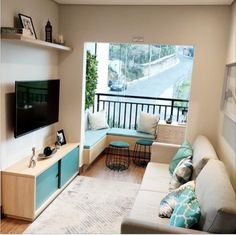 a living room filled with furniture and a flat screen tv on top of a wall