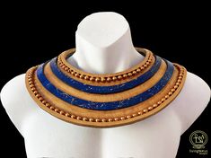 Ancient Egyptian collar based on discoveries from tombs, paintings, statues and jewellery found in Egypt and museums around the world. Called an Usekh it was worn by gods, royalty and the elite alike. Made from strong, durable EVA foam with acrylic embellishments. Hand painted Lapis-Lazuli look ornamentation. Constructed to order and available in three sizes - Small, Medium and Large. Please provide your shirt size when you place your order. Biblical Clothing, Egyptian Collar, Egyptian Ornamented, Egyptian Clothing, Egyptian Fashion, Egyptian Necklace, Body Adornment, Tutankhamun, King Tut