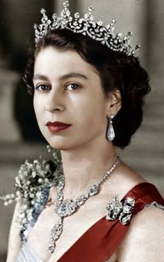 an old photo of a woman wearing a tiara