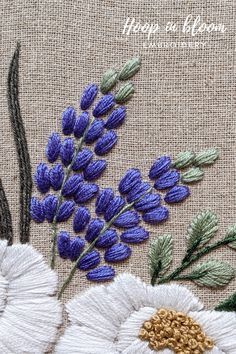 a close up of some flowers on a piece of cloth