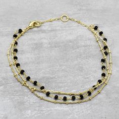 Black Onyx Beaded Bracelet, 3 Layer Chain Handmade Bracelet, Minimalist Jewelry, Size 7.5" A1B-140 Metal:- Brass Plating:- 22k Gold Plated  Gemstone Name: Black Onyx Bracelet Size:- 7.5 Inches  Gross wt:- 4 gm -------------------------------------------------------------------------- I am specially making jewelry for Wholesale Orders. Top US, UK, and Australia handmade Jewelry Boutiques and chain stores are my wholesale customers. Wholesale prices are different Please provide me with product numbers and their quantity so that I can give you Wholesale prices. Layer Chain, Black Onyx Bracelet, Bracelet Minimalist, Layered Chains, Onyx Bracelet, Onyx Bead, Handmade Bracelet, Bracelets And Charms, Boutique Jewelry