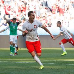 the soccer player is celebrating after his goal