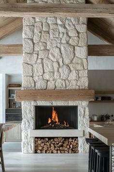 a fireplace with logs in the middle of it