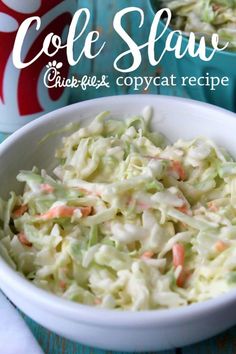 coleslaw in a white bowl with carrots and celery on the side