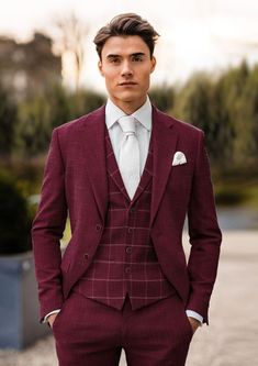 a man in a red suit and white shirt