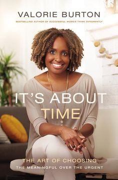 a woman sitting on top of a couch in front of a wall with the words it's about time