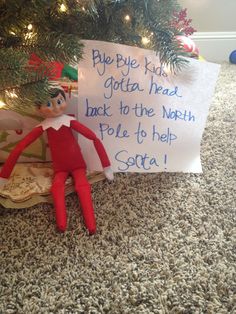 an elf is sitting under the christmas tree with a sign on it that says, pie bye kids getter heads back to the north pole to help santa