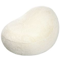 a large white pillow sitting on top of a table