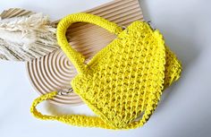 Discover the charm of handmade with this one-of-a-kind crochet yellow summer purse. Skillfully crafted with love and attention to detail, each stitch showcases the artisan's dedication to quality. Perfect for adding a pop of color to your outfit, this purse is both stylish and functional. Ideal for anyone who appreciates unique accessories or as a thoughtful gift. Size & Materials: Polyester cord with stainless steel accessories Size of the purse is approx. 8 x 6 x 1.75 inches Size of the handle is approx. 12 inches (long one), 3.5 inches (short one) Please note - each piece is meticulously crafted, ensuring that every crochet purse is a one-of-a-kind accessory. We are not able to repeat the same item, due to creativity and uniqueness of our artisan. Check out more styles & colors here: ht Crochet Yellow, Yellow Purse, Summer Fashion Women, Summer Purse, Yellow Purses, Shoulder Bag Vintage, Summer Purses, Steel Accessories, Stainless Steel Accessories