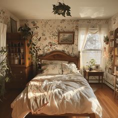 a bed sitting in a bedroom next to a window with lots of plants on it