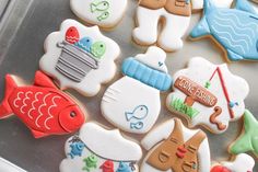 several decorated cookies sitting on top of a pan