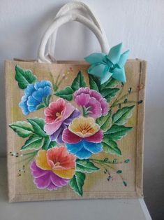 a bag with flowers painted on it