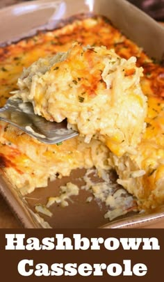 hashbrown casserole in a baking dish with a serving spoon scooping out