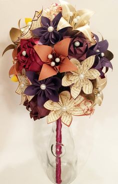 a bouquet of paper flowers in a vase