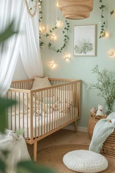 a baby's room decorated with greenery and hanging lights in shades of green