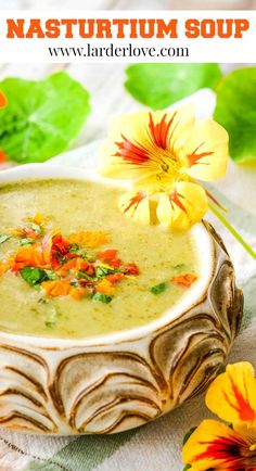 a close up of a bowl of soup with flowers in the background and text overlay