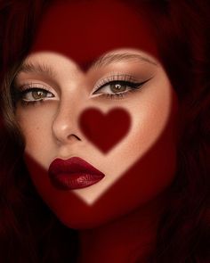 a woman's face with the shape of a heart painted on it