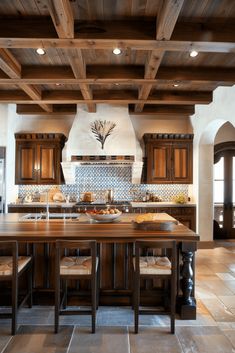 a large kitchen with wooden cabinets and an island in the middle, along with tile flooring