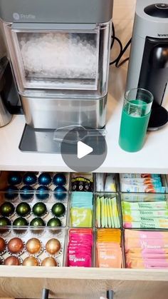 a coffee maker and some drinks on a table