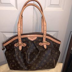 Absolutely Awesome Condition For This Louis Vuitton Tivoli Gm ..Almost Immaculate Except For A Slight Patina But Not Much. I Rarely Used This Bag Since Purchased Brand New. You Will Absolutely Love The Roominess Of This Bag! It’s Def A Classic!! Respectful Offers Welcomed Dimensions Are 17.75” In Width 10.5” In Height.. Straps Are 8.75” & The Depth Is 7.75” Original Lv Dustbag Included Louis Vuitton Tivoli, Louis Vuitton Bags, New You, Authentic Louis Vuitton, Louis Vuitton Bag, Patina, Dust Bag, Bag Lady, Louis Vuitton