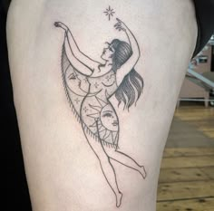 a woman with a tattoo on her thigh