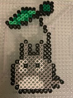 an image of a cat made out of legos on a table with the letters 80