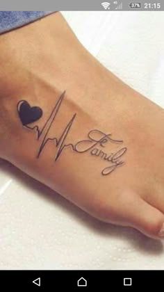 a person with a heart and heartbeat tattoo on their foot